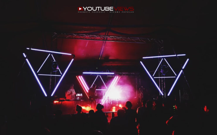 Live music stage with neon lights and the YouTubeViews logo