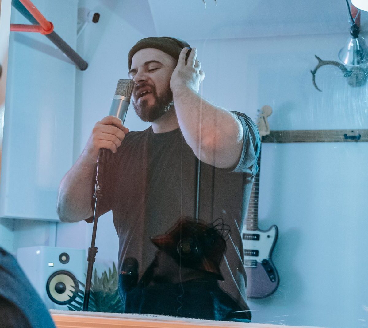 Artist recording vocals in a music studio