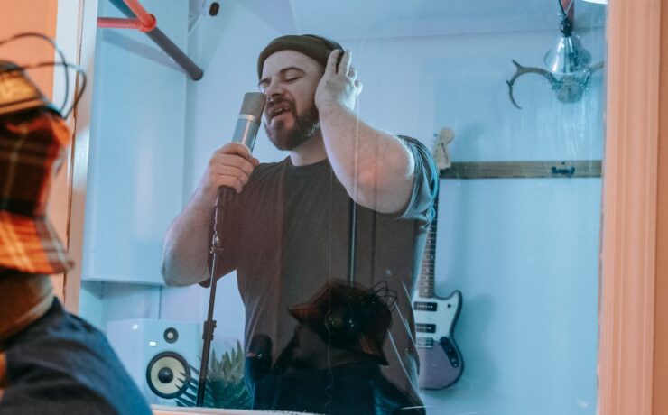 Artist recording vocals in a music studio