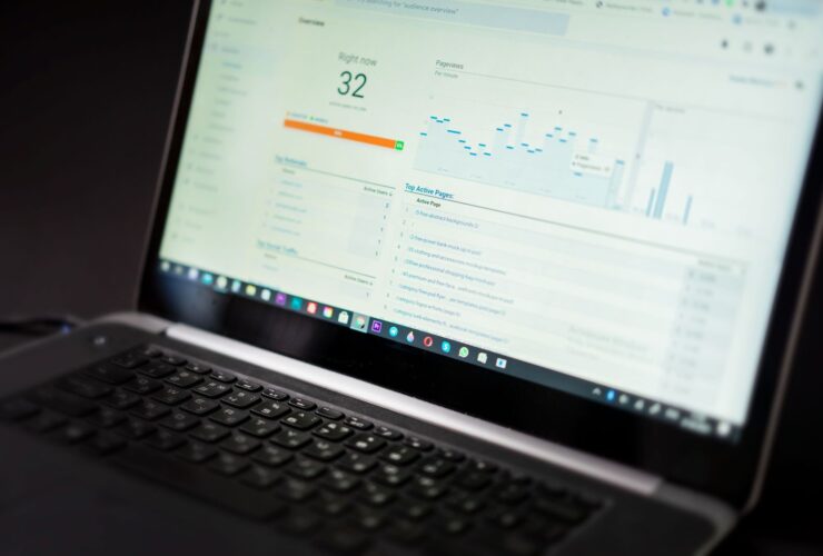Laptop showing a real-time analytics dashboard with views and traffic charts